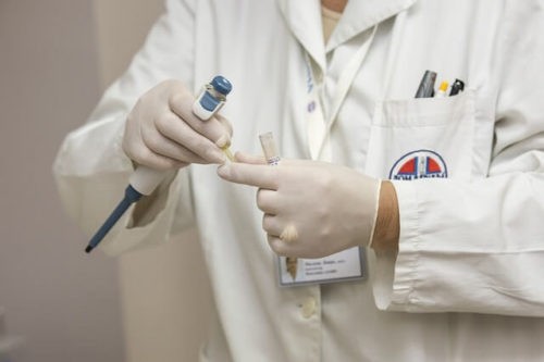 A lanyard is a cord or strap with a connector at the end for attaching nametags, whistles or other small things. You wear it on your neck.